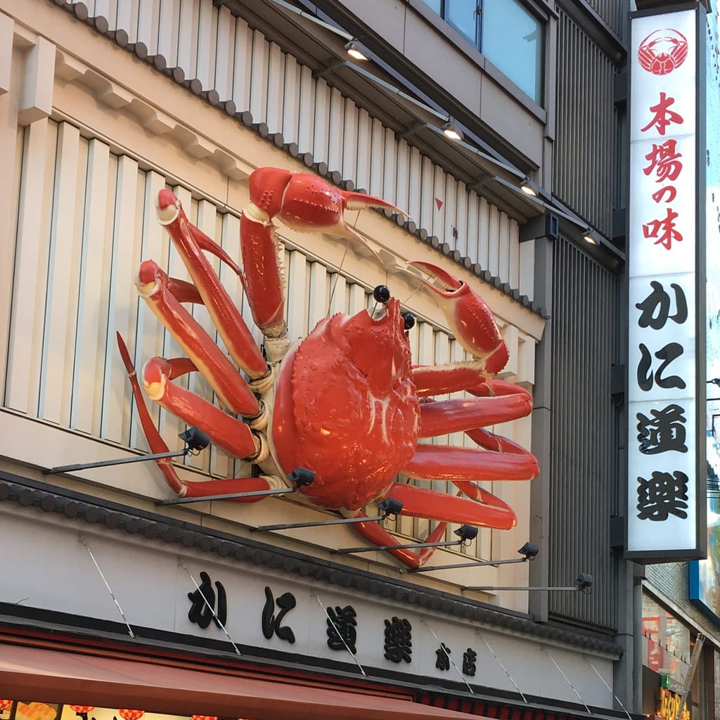 A giant red crab on the side of a building on Dotonbori street in Osaka
