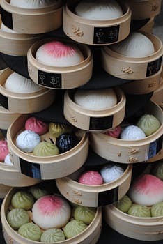 Stacks of steamed dumplings sit outside a restaurant on display