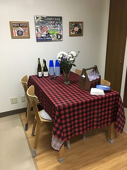 Dining room table set with a buffalo checked tablecloth