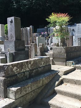 Stone monuments stacked close together form a Buddhist cemetery