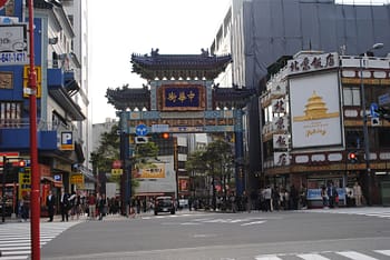 A blue gate marks the east entrance of Yokohama's Chinatown
