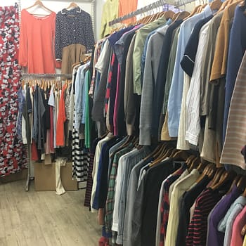 Racks of used women's clothing for sale at 300 yen thrift store