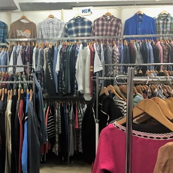 A selection of used men's clothing for sale at the 300 yen thrift store