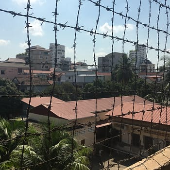 Barbed wire blocks the walkway of the upper floors in the S-21 prison Tuol Sleng