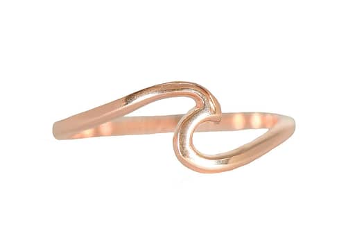 Image from pura vida website showing a rose gold, wave shaped ring against a white background