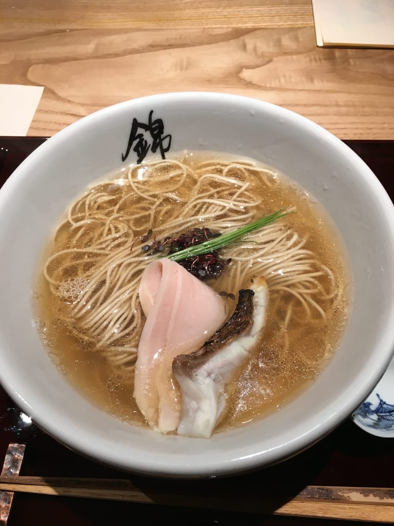 A bowl of salt broth ramen with pork and fish.